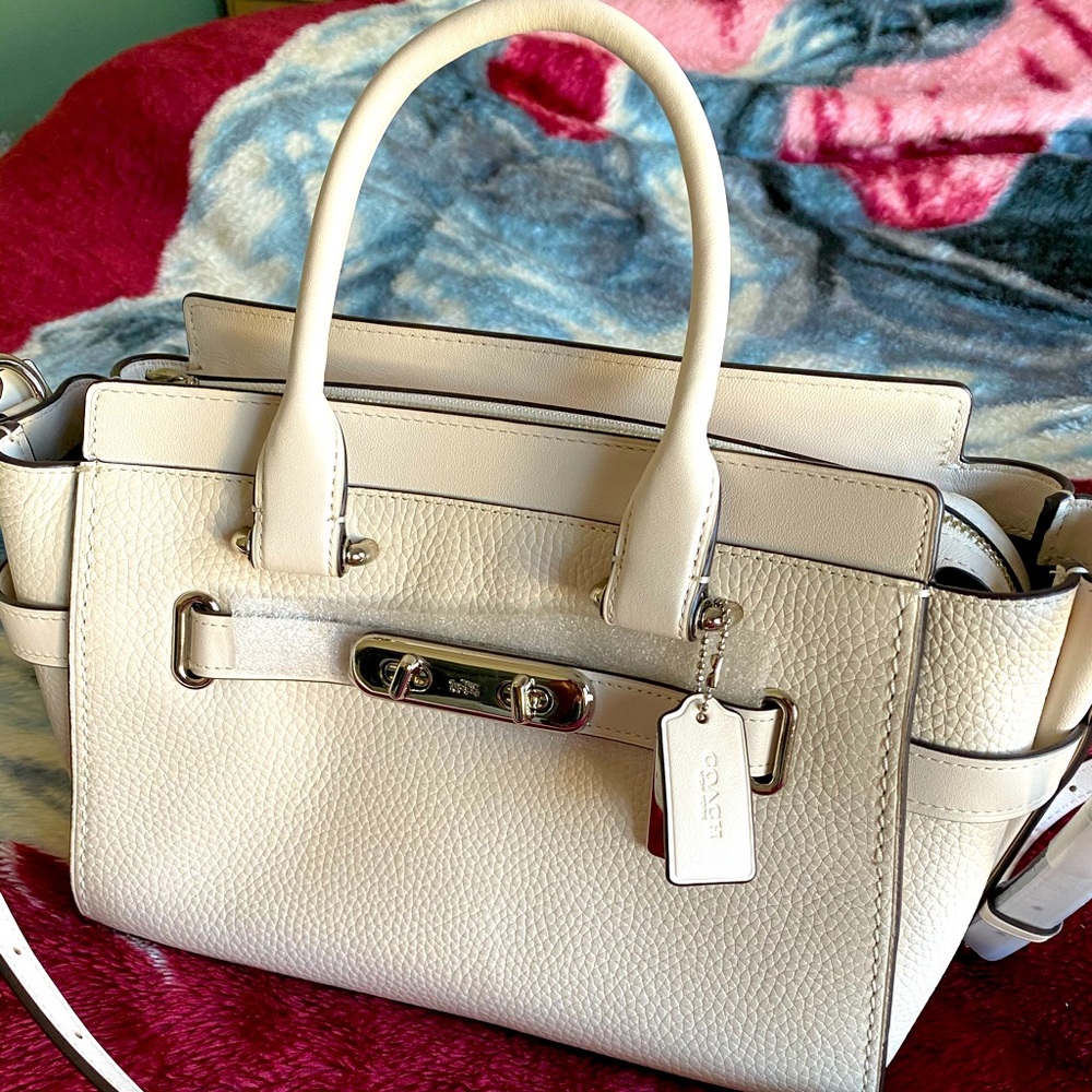 Coach crossbody bag with detachable strap.